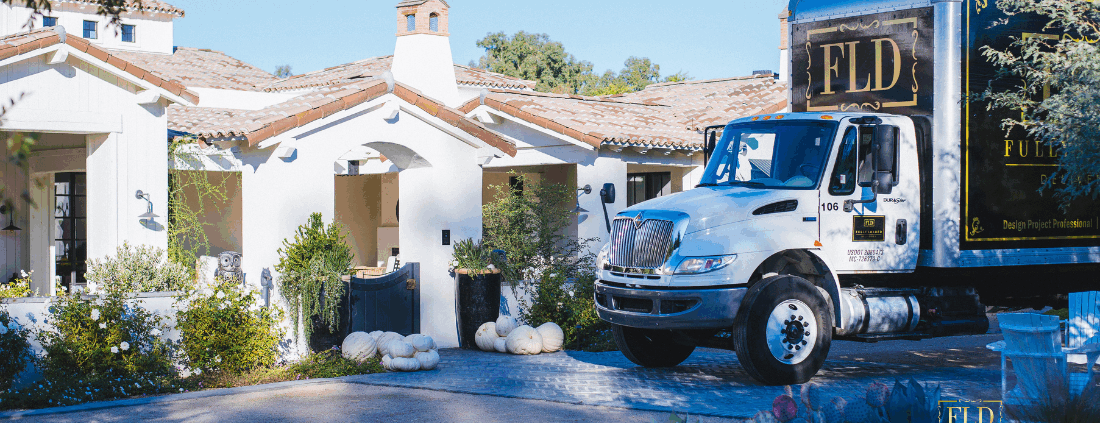 Fully Loaded Deliveries moving truck arriving for designer installation services.